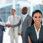 Asian business woman with hands folded with colleagues in the ba
