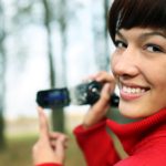 woman with a digital video camera