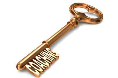Coaching - Golden Key on White Background. 3D Render. Business Concept.