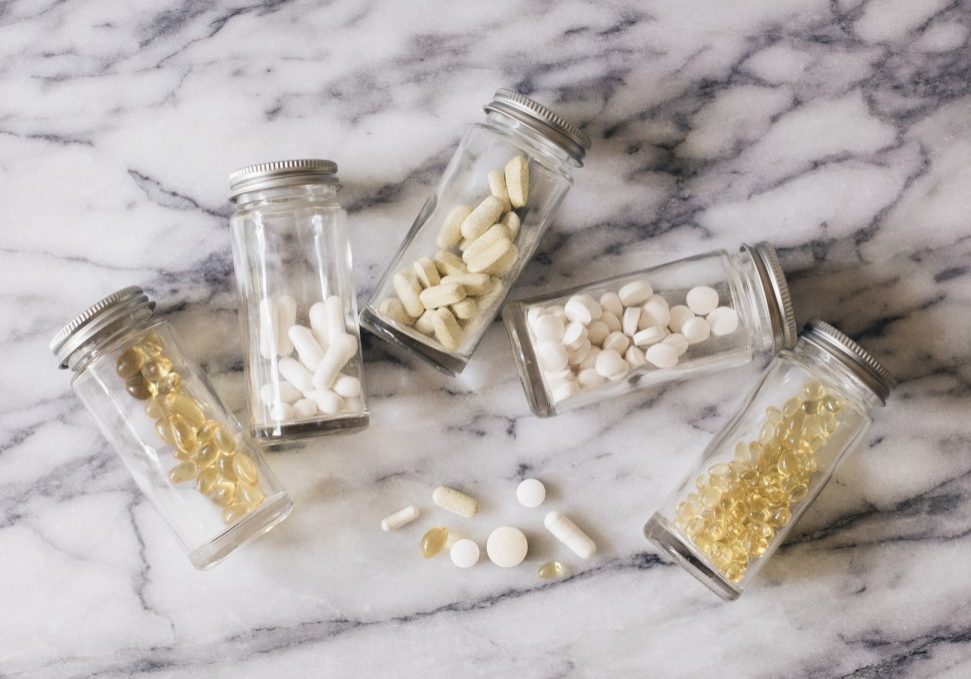 vitamins-in-jars-on-a-marble-counter_t20_loVebB